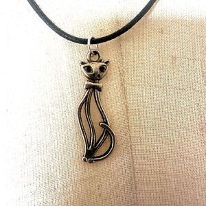 Silver  tone cat pendant necklace on black cord
